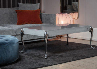 Flightdeck concrete coffee table with polished table legs. Design Morten Voss