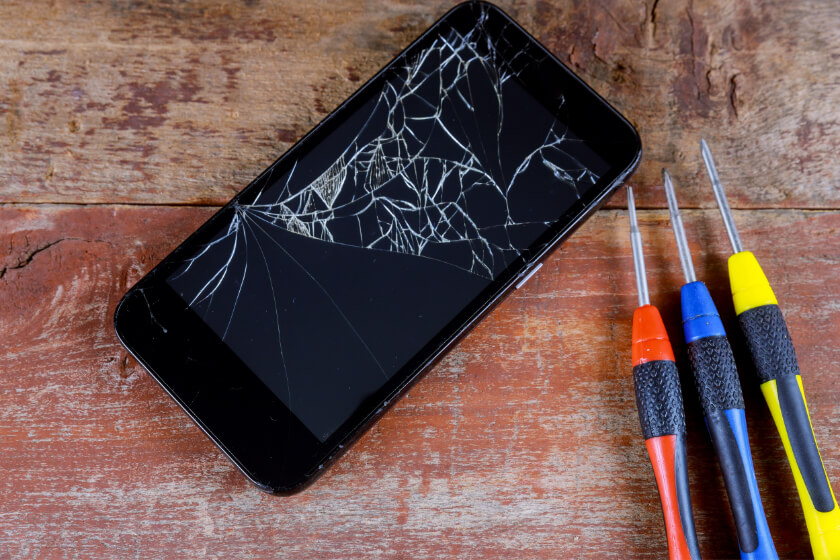 smart phone repair with screwdriver with broken sc F9WS9TL