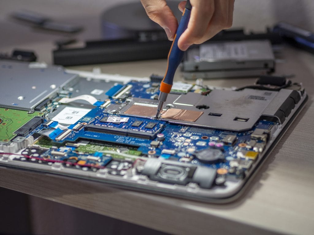 closeup shot of a person repairing a tablet with a 2023 01 26 10 17 18 utc