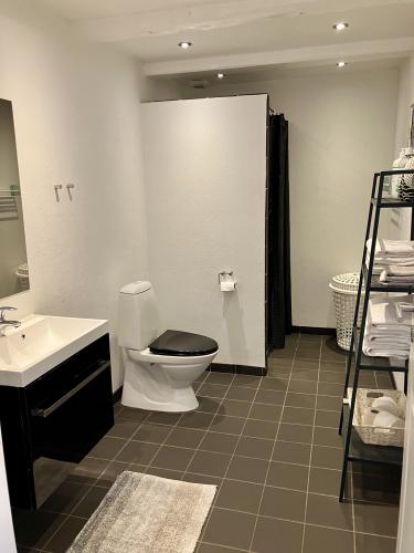 Private bathroom with toilet, shower and heated floors