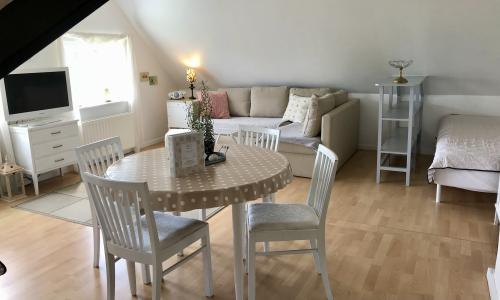 Dining table and sofa in sitting area