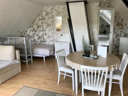 Second single bed in background; mini fridge to right