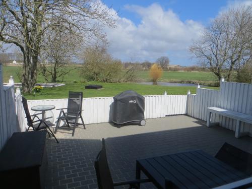 Terrace with seating and grill