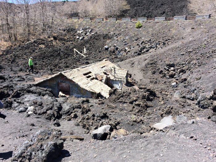 Old house submerged by lava