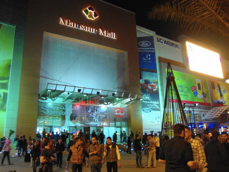 Customers at Mansour Mall in Baghdad, Iraq must file past armed guards in camouflage, separate male and female pat-down rooms and metal detectors before reaching off-brand fast food purveyors including Subz, Pizzarro and Krunchy Fried Chicken.