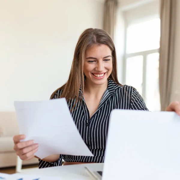 business-woman-analyzing-data-using-computer-while-spending-time-office-beautiful-young-grinning-professional-woman-office-graphs-charts