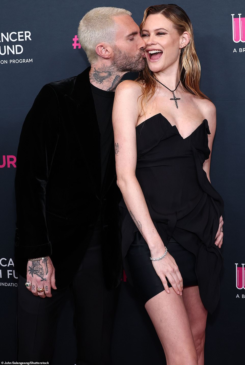 What controversy?: Adam Levine and Behati Prinsloo put his sexting scandal behind them and presented a united front at the gala, ostentatiously showering each other with affection in front of the cameras