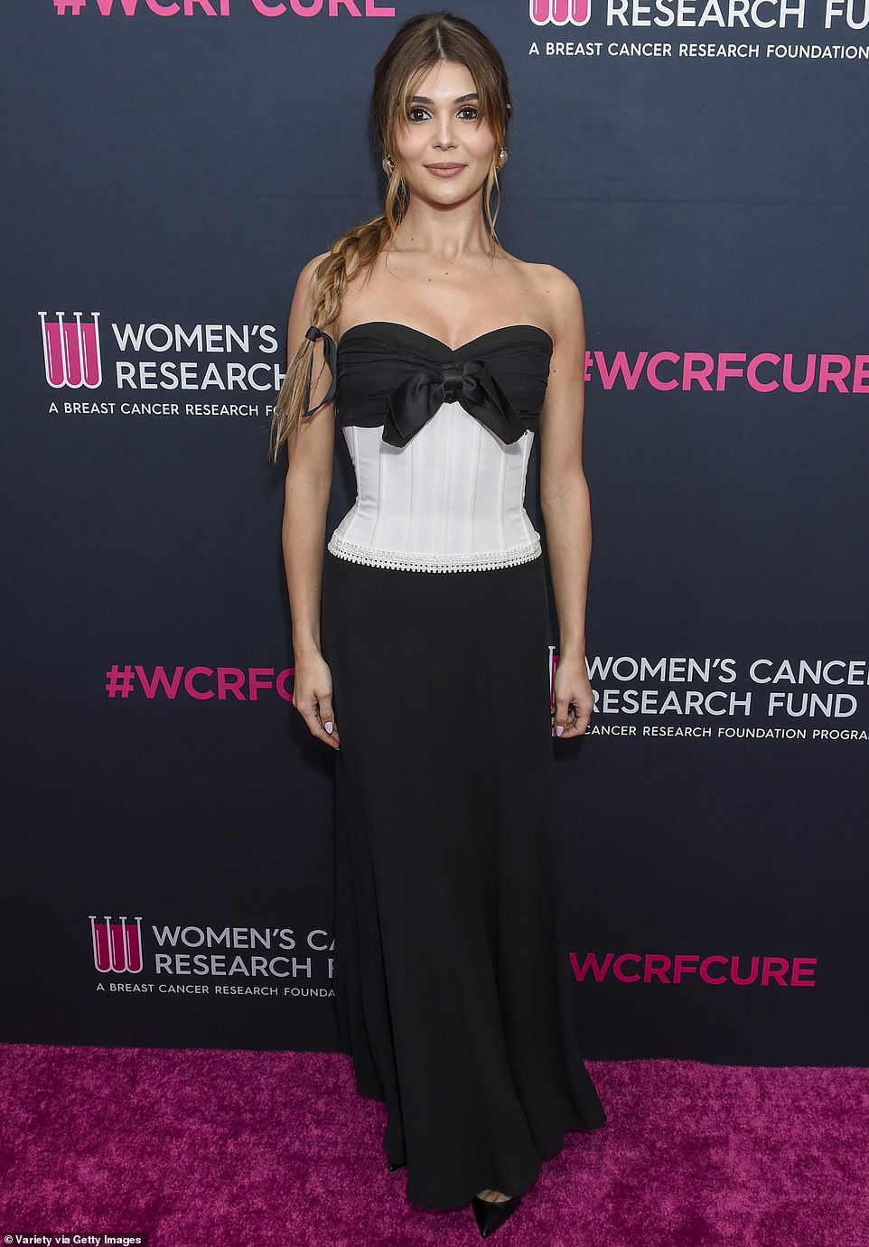 There she is: Lori Loughlin's daughter Olivia Jade, who became internationally notorious through her connection to the 'Varsity Blues' college admissions scandal, hit the maroon carpet in a monochrome corset number