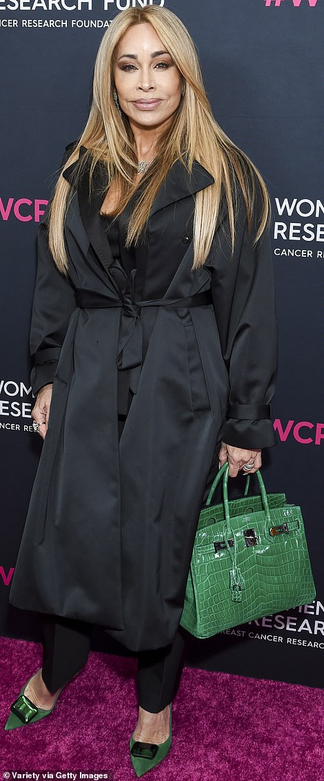 Unmistakable: Nicole Brown Simpson's pal Faye Resnick clashed her black outfit against a popping green bag and pair of shoes