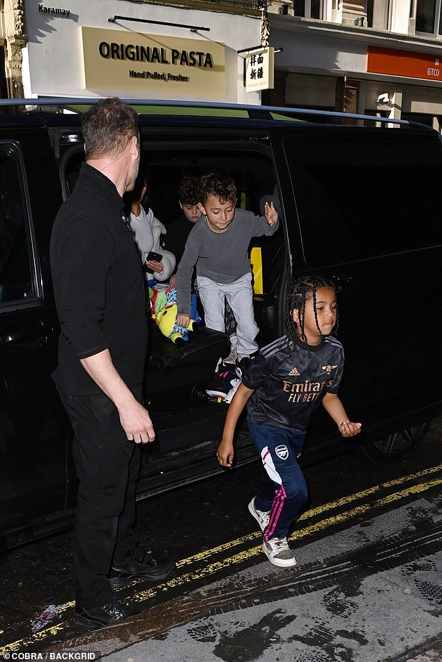 Can't wait: While Saint and his pals looked thrilled as they excitedly hopped out of the car before heading inside