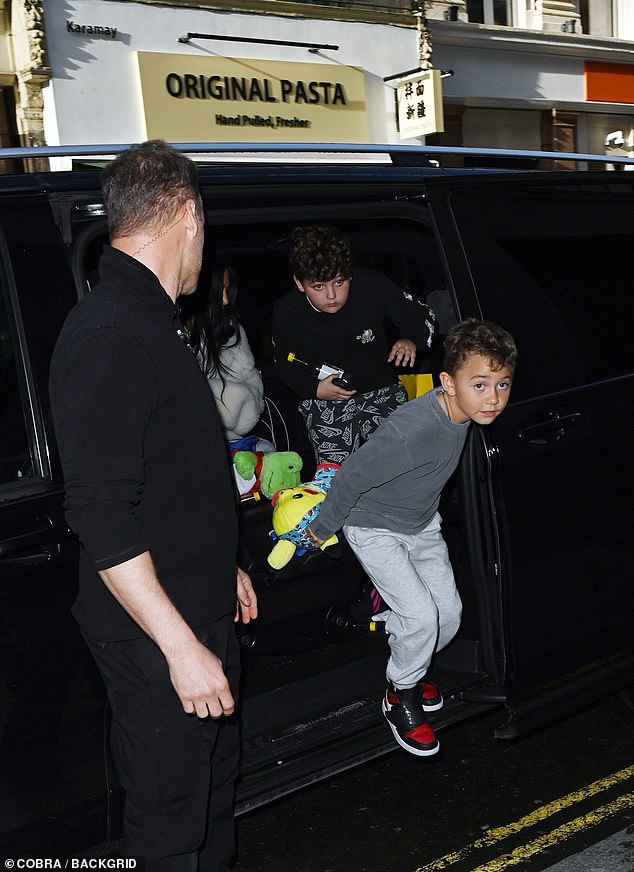 Let's go: The youngsters excited climbed out the car as they arrived at their next London destination