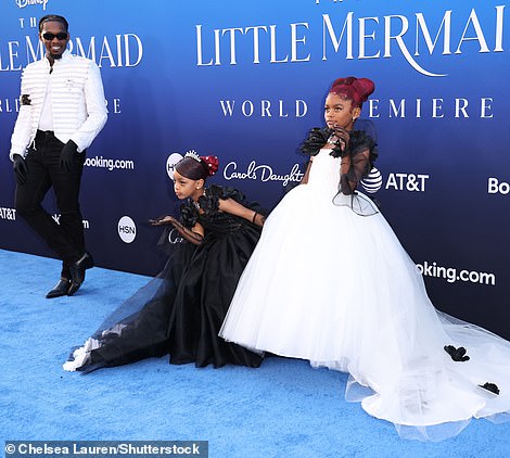 The rapper brought along his two daughters who stole the show in their black and white princess gowns