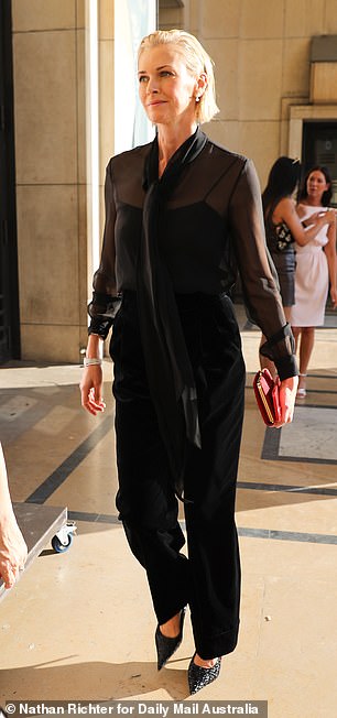 The statuesque blonde accessorised her look with a red clutch and sparkly pointy-toed pumps