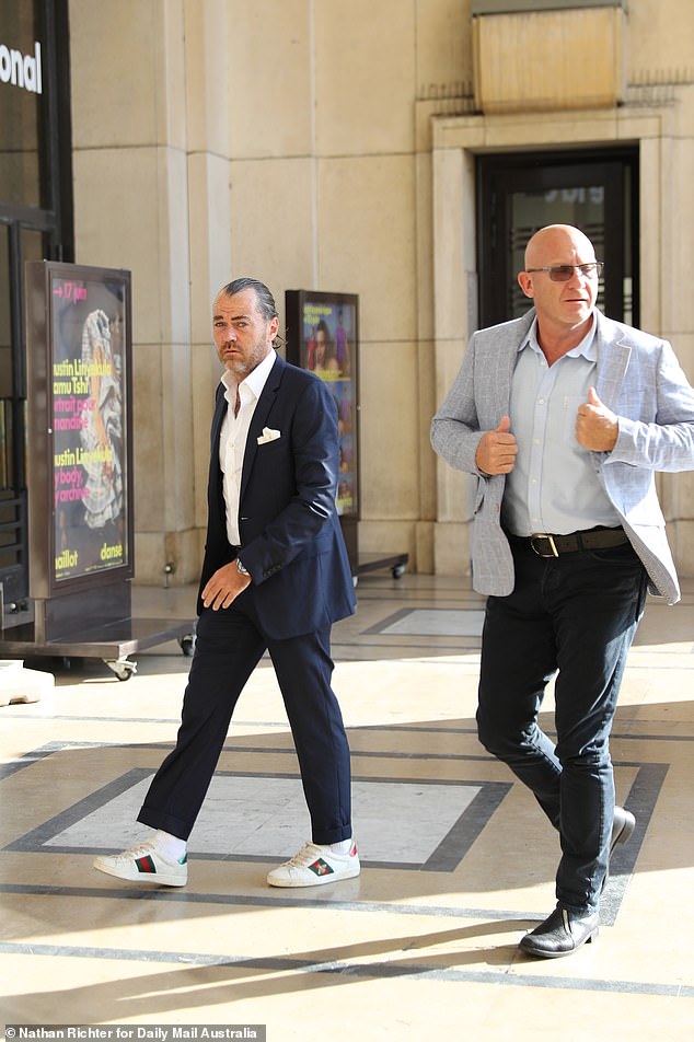 Moran, 54, wore a pair of navy trousers and a pale blue shirt that wast layered with a grey check sports jacket