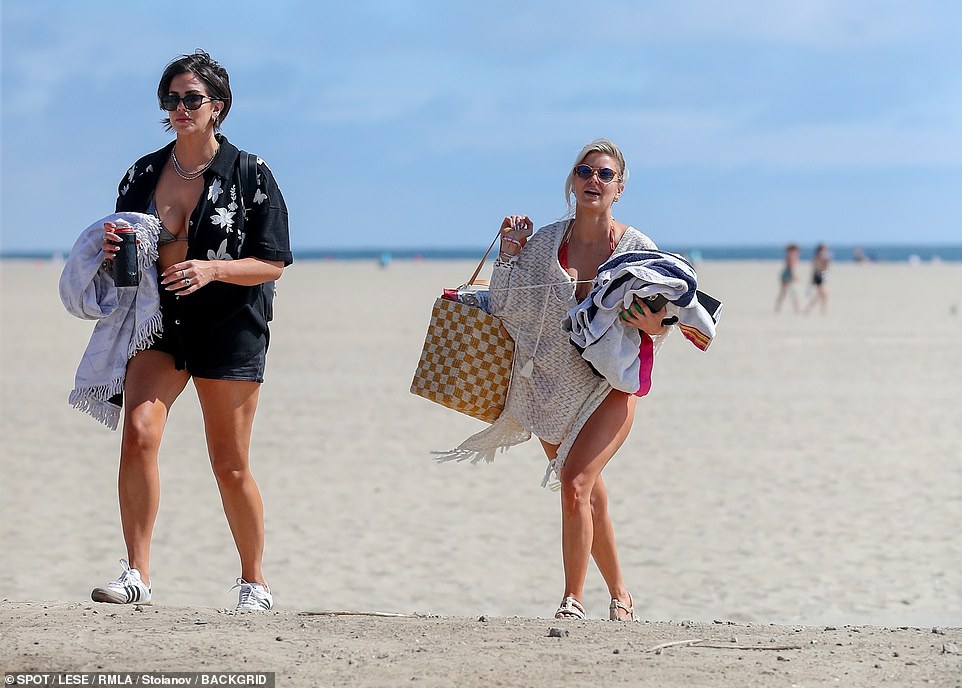 Quite the haul: Madix toted multiple bags and beach towels