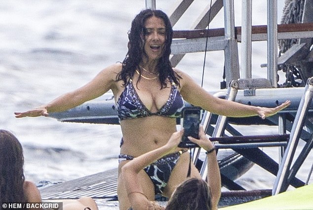 She's still got it! She looked considerably younger than her 56 years as she frolicked in the water and posed for playful selfies with friends who had accompanied the couple
