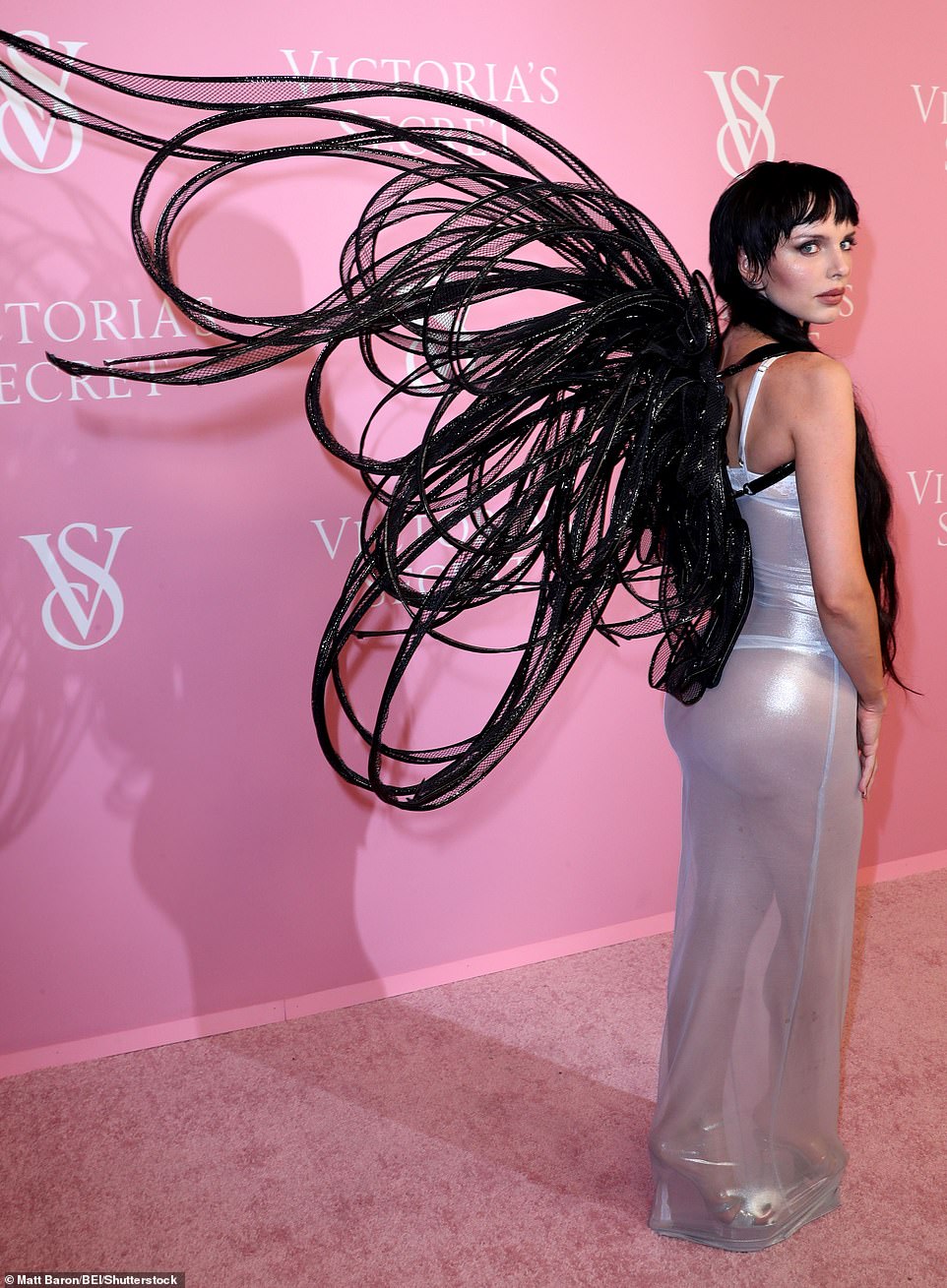Angelic: The actress/model made her way down the red carpet with spooky black mesh wings on her back