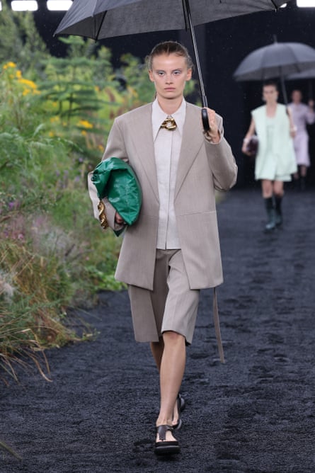 Model with umbrella at the Jil Sander spring/summer 2023 catwalk during Milan Fashion Week