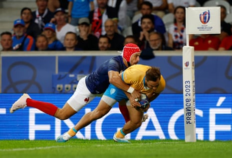 Nicolas Freitas goes over for a try for Uruguay.