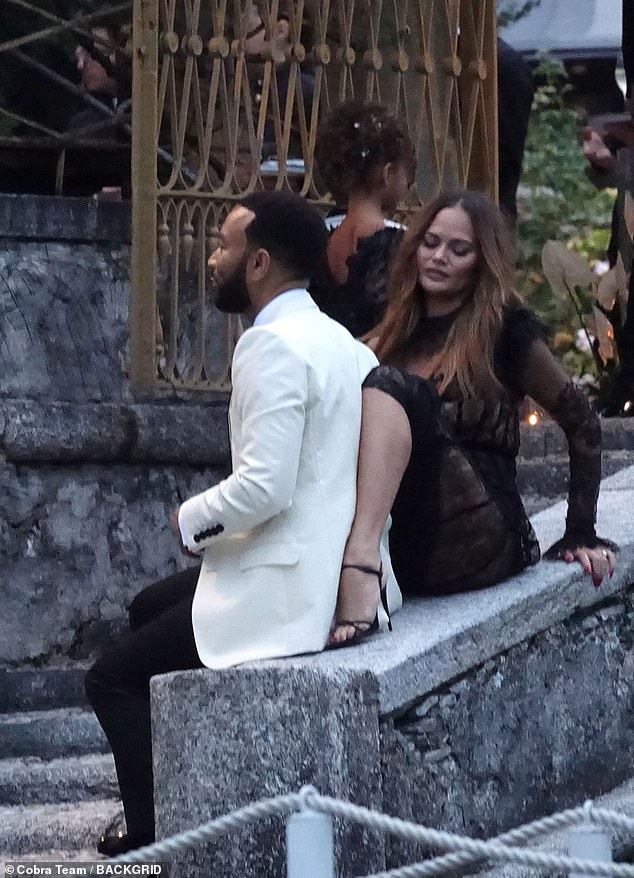 Close contact: The love birds showed off some PDA while relaxing for a moment