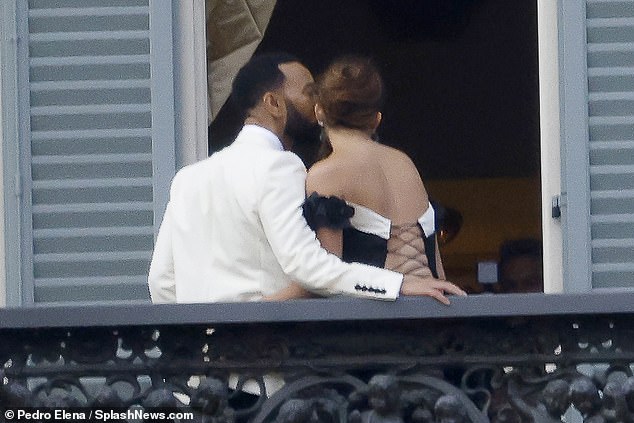 Private time: John guided his wife back into the villa