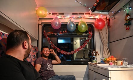 Passengers hang fairy lights and balloons in their sleeper cabin on the Doğu Express.