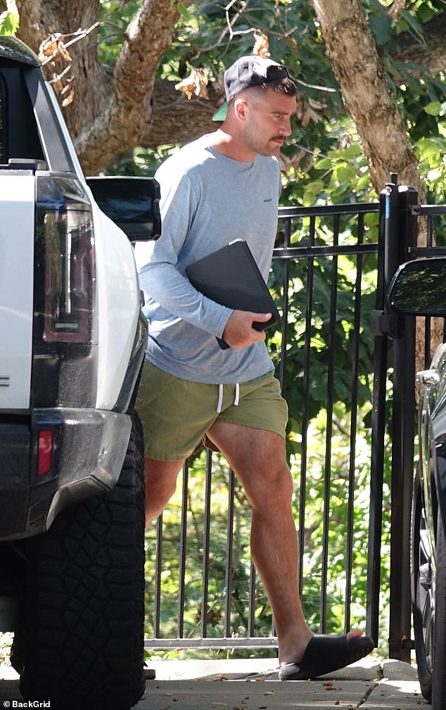 Love Story: Travis carried his IPad in one hand as he showed off his muscled legs in his olive colored shorts