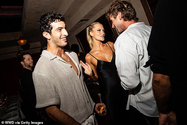 Looking good: Poppy styled her long blonde tresses in a neat ponytail as she beamed for photos on arrival