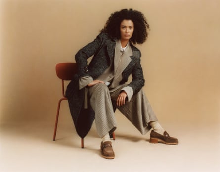 Model wearing long charcoal grey wool coat
