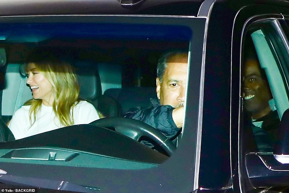 Catching a ride! Olivia Wilde was spotted departing the bash with Chris Rock