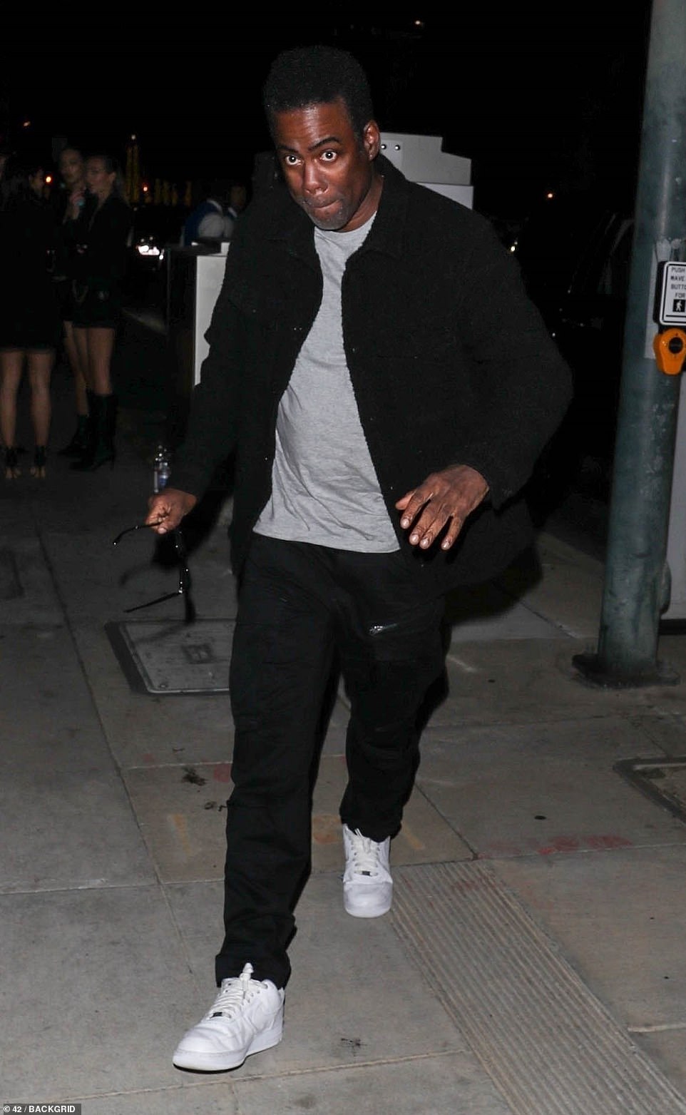 His look: Rock, 58, was casually dressed in black pants, a gray crew neck shirt, and a black jacket