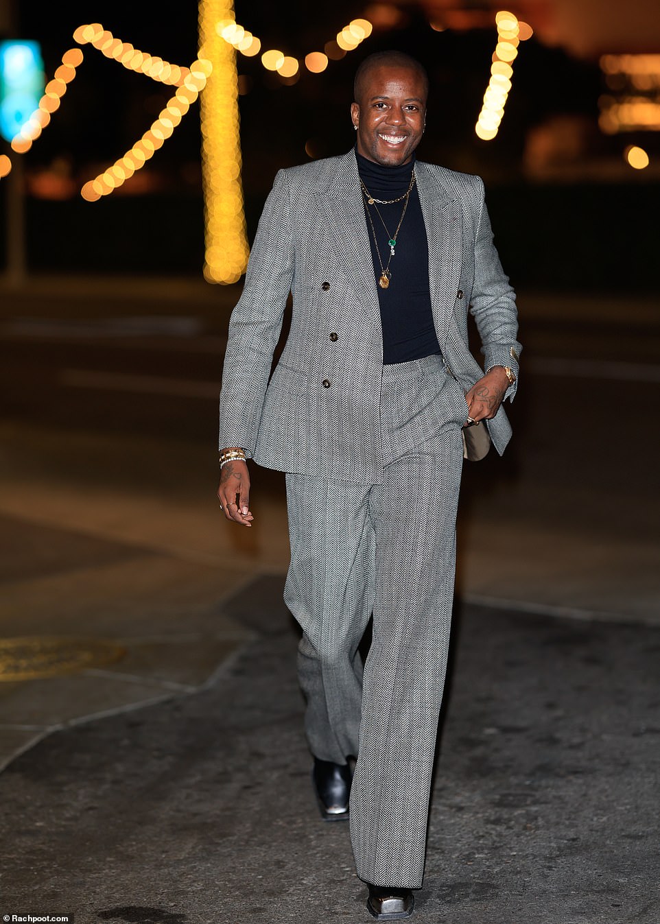 Handsome! Vas J Morgan, 34, cut a stylish look in a grey suit and a black T-shirt