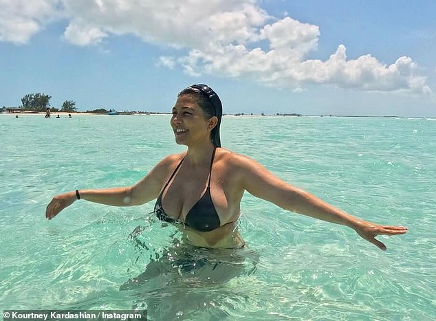 Here she was seen on a recent vacation with her sisters and Travis