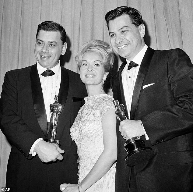 The songwriter - who notably collaborated with his brother Robert B. Sherman over the years - died due to an 'age-related illness' in Los Angeles at Cedars-Sinai Medical Center, Disney announced; seen far right with brother Robert (far left) and Debbie Reynolds in 1965