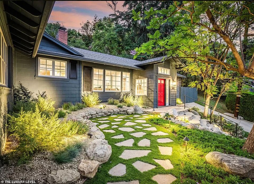 Originally constructed in 1956, the residence underwent a complete redesign to enhance contemporary living, featuring an updated floor plan, bespoke kitchen cabinetry, newly installed hardwood floors, and integrated smart home technologies