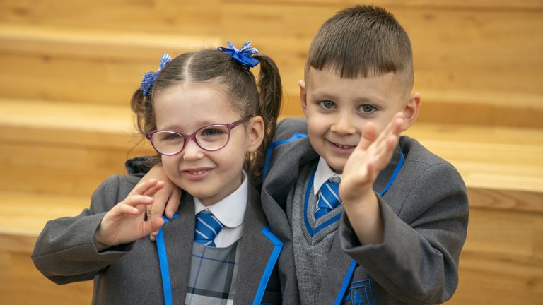 Twins Eva-Grace and Greyson McNab, who are due to start the new school term in the Inverclyde area, pose for a photograph at St Patrick's Primary School in Greenock, Inverclyde, ahead of their first day at school. Picture date: Tuesday August 13, 2024.