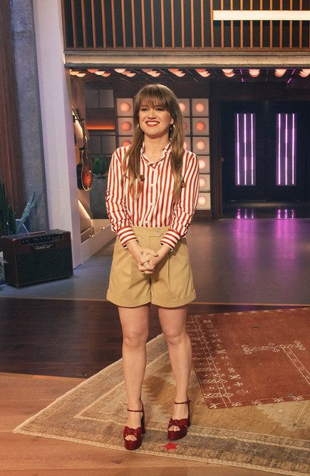 Kelly Clarkson teamed the striped silk blouse with tailored shorts and platform heels to host her show in July