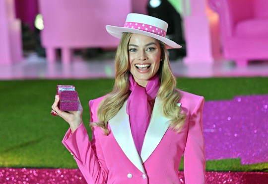 Margot Robbie poses for a photo during a pink carpet event to promote Barbie in Seoul on July 2, 2023