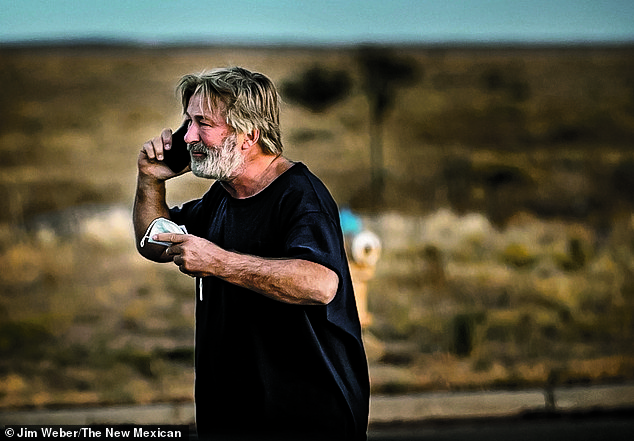 Baldwin, seen here outside the Santa Fe County Sheriff's offices on the day of the shooting, had charges brought against him twice
