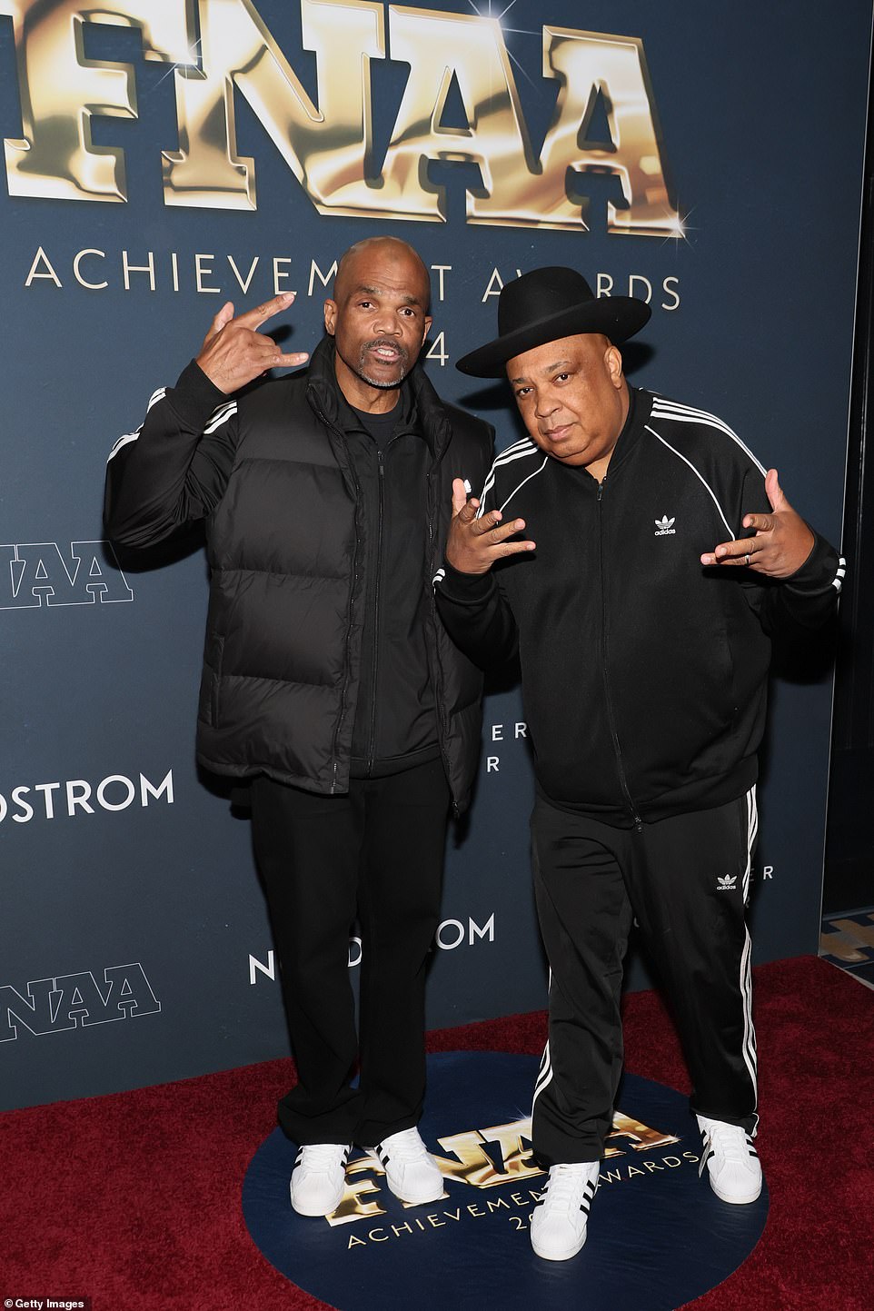 Run-DMC's Darryl McDaniels and Joseph 'Rev. Run' Simmons proudly rocked Adidas sneakers and activewear for the NYC ceremony