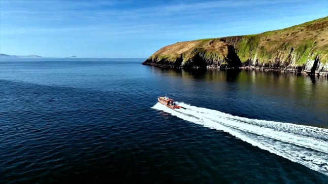 Story from Jam Press (Uninhabited Island Job) Pictured: A boat with views of the Great Blasket Island. Island with ZERO POPULATION looking for two people to run coffee shop? but there?s a catch An isle with a population of zero is looking for two people to run a coffee shop? but there is a catch. Great Blasket Island is hiring a pair of caretakers to live there this summer. But, despite it having no residents, there will be a lot of customers to serve. Because the isle off the coast of Dunquin, near Dingle, Ireland, does attract 40,000 holidaymakers a year. Great Blasket Island, is located off the Dingle Peninsula and is the largest of the Blasket Islands. The island is seeking a couple to run the show, taking over running the coffee shop and holiday cottages for six whole months. From 1 April to 1 October, they will be paid a wage to be in charge. But despite the once-in-a-lifetime opportunity to be able to stay on a remote Irish island, hard and strenuous labour will have to be completed. Tasks including coffee shop prep, cleaning each holiday house and checking in guests, will need to be completed to a high standard daily. And applicants might not even manage to grab a day off for weeks at a time, it is all determined by the weather. All job hopeful?s rent will be included for the duration of their post on the island. In terms of living quarters and conditions, they?ll be sharing the main bedroom above the coffee shop. They?ll have to use the shop?s kitchen and toilets as their very own, with a stove available to light up your evenings. Laundry will be collected and transported to the mainland where it will be washed. They don?t need to fear as food shops will also be delivered daily. In the busy summer months of June, July and August they may also be sharing the upstairs. Volunteer helpers will sleep in the second bedroom upstairs too, so applicants will have some other company for the long evenings, as reported by What's The Jam. However, if they want to keep clean and enjoy the occasional evening tipple, they'll have to come readily prepared as these items will not be included in the food shops. The island is a ?Special Area of Conservation?, is four miles long and has over 1,1000 acres to explore. It has been uninhabited since 1953 and is known for being one of the most remote Irish-speaking areas of Corca Dhuibhne. ENDS