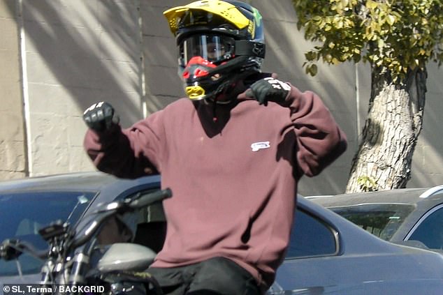 The Los Feliz resident wore black-and-white gloves as he lifted his hands in the air