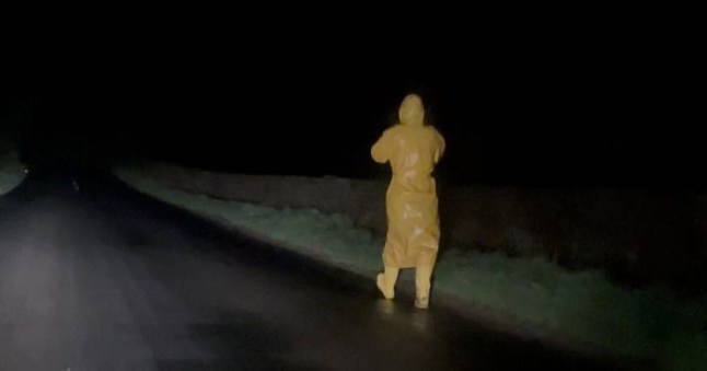 Warning as 'suspicious yellow man' wearing mask caught loitering in creepy clip GERARD MCFERRAN