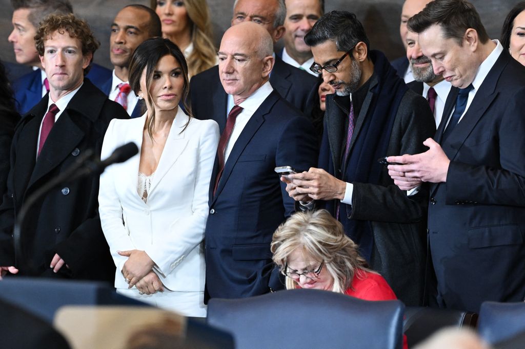 Lauren Sánchez brought power-dressing to the party in a crisp white pantsuit with a daring lace top peeking through. Sharp tailoring and a plunging neckline gave her look a bold edge, while her delicate earrings kept it classy.