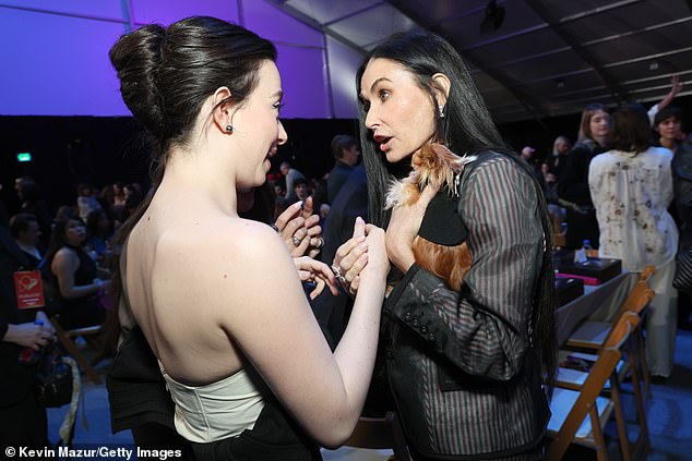 The win was a shocking upset over awards-season favorite Demi Moore. But Demi was seen getting along with Mikey earlier in the evening when they had a cute chat while Demi held her adorable fun-size dog Pilaf