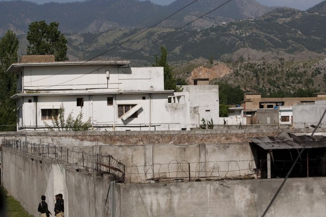 ABBOTTABAD, PAKISTAN - MAY 3: Pakistani police guard a gate outside Osama Bin Laden's compound, where he was killed during a raid by U.S. special forces, May 3, 2011 in Abottabad, Pakistan. Bin Laden was killed during a U.S. military mission May 2, at the compound. According to reports May 4, 2011, the Obama administration has decided not to release photographs of Bin Laden's body. (Photo by Getty Images) Joel Adams