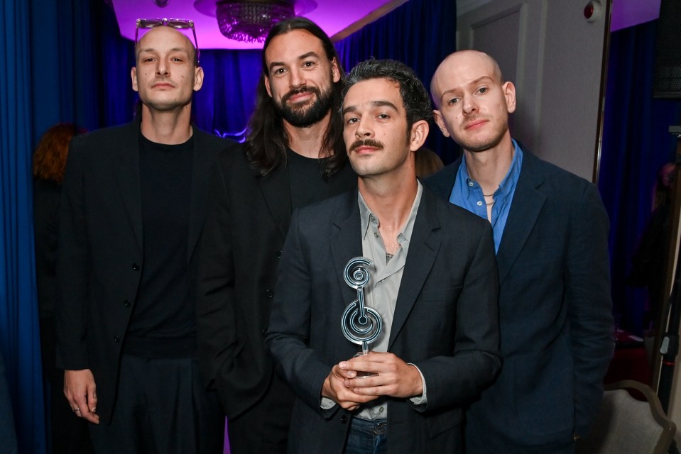 The 1975 band accepting a Best Group award.