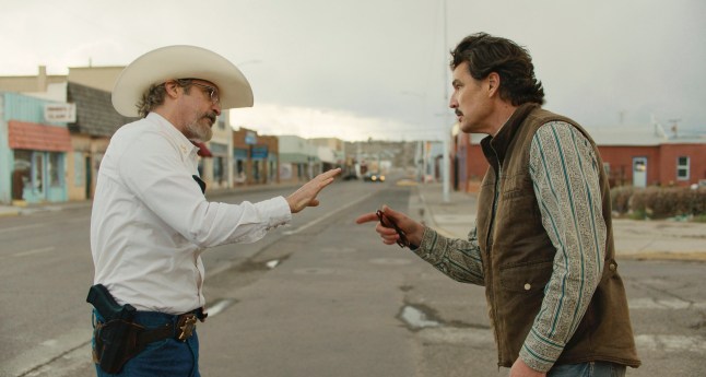 This image released by A24 shows Joaquin Phoenix, left, and Pedro Pascal in a scene from