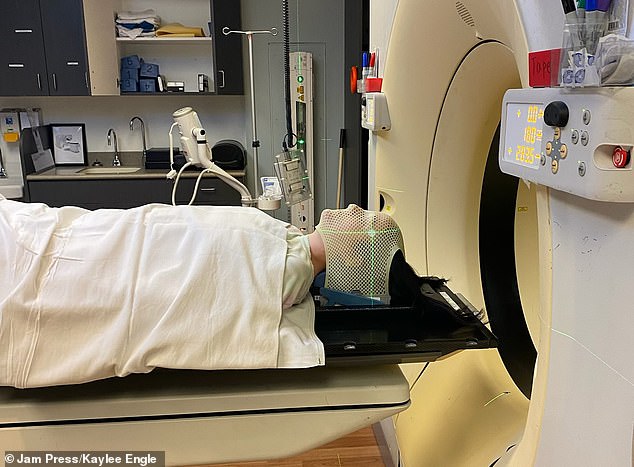 Engle, shown entering the MRI machine, has received 18 rounds of an immunotherapy drug called Nivolumab. The results were mixed initially, with some tumors shrinking and some growing. But most lesions have stabilized