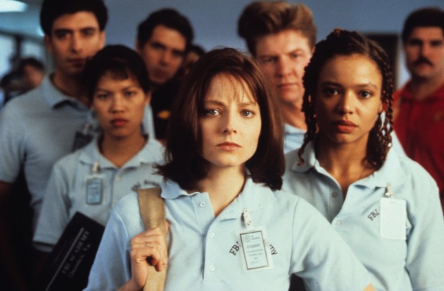 Jodie Foster in The Silence of the Lamvs surrounded by a group of people